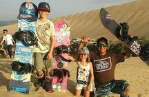 Sandboarding or Sand Ski in Huacachina Apresski bonfire Sunset