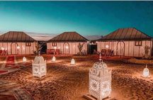 Merzouga: Overnight in Luxury Desert Camp with Camel Ride, meals & sandboarding