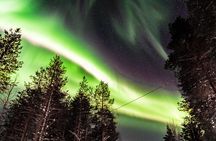 Hunting Northern Lights by Snowmobiles