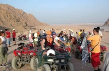 Sunset Desert Safari Trip by Quad Bike with Camel Ride and Bedouin Dinner 