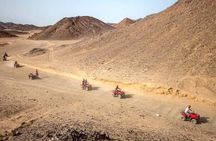 Sunset Desert Safari Trip by Quad Bike with Camel Ride and Bedouin Dinner 