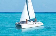 Wild adult catamaran party sailing to Isla Mujeres