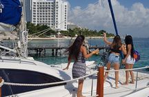 Wild adult catamaran party sailing to Isla Mujeres