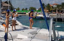Wild adult catamaran party sailing to Isla Mujeres