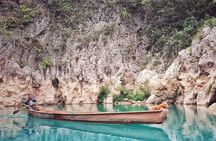 Tamul waterfall and water cave on a wooden canoe