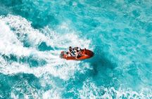 Jet Skiing around La famille ship and smaller pristine cays