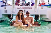 Lil Restless Private Catamaran Adventure - Snorkel SUP Cliff jump