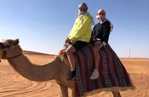 One hour Quad Bike at Red Sand Desert Safari with Camel Ride and BBQ Dinner