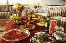 Evening desert safari with camel ride and BBQ dinner