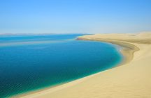 From Doha Airport: Desert safari and Inland Sea Tour.