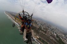 Fly paragliding along the coast of Lima