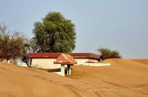 The Ghost Village Safari Tour with Dune Bashing and Sandboarding