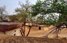 The Ghost Village Safari Tour with Dune Bashing and Sandboarding