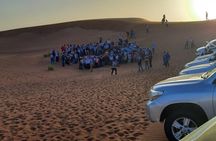 Evening Desert Safari with BBQ Dinner, Sandboarding and Camel Ride Experience