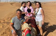 Evening Desert Safari with BBQ Dinner, Sandboarding and Camel Ride Experience