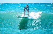 Learn to surf with a local big wave rider on the North Shore of Oahu