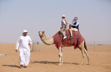 Dubai Desert Safari with Quad Bike, Dune Bashing, Camel Ride, Sand Boarding &BBQ