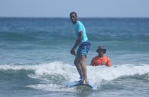 Surfing lesson at beautiful beach Playa Encuentro