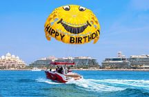 Parasailing in Dubai with Palm Jumeirah and JBR Beach views