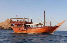 Omani Traditional Dhow Cruise: Sunset and Muscat Coastal View