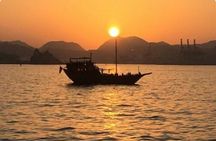 Omani Traditional Dhow Cruise: Sunset and Muscat Coastal View
