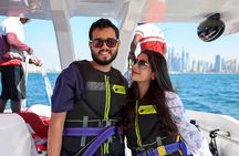 Parasailing in Dubai with Palm Jumeirah and JBR Beach views