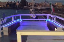 Sunset boat tour with aperitif and swimming break