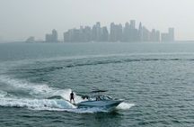 Private Wakesurfing or Wakeboarding along Doha's skyline