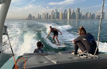 Private Wakesurfing or Wakeboarding along Doha's skyline