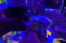 Paint a neon fluorescent picture while drinking unlimited wine