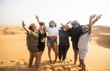 Dubai Half-day Red Dunes bashing with Sandboarding, Camel &Falcon