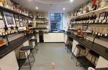 Distill a bottle of gin on mini copper stills