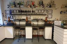 Distill a bottle of gin on mini copper stills