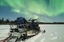 Northern lights safari by snowmobile