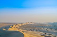 Full-day Qatar desert safari: dune bashing, sandboarding, camels