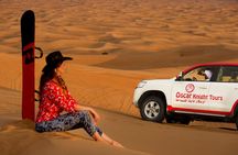 High Red Dunes with Camel Ride, Sandboarding, Falcon Show and VIP BBQ Dinner
