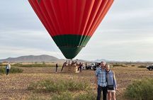 Hot air balloon flight in the desert with camel ride