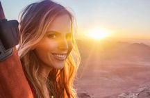 Hot air balloon flight in the desert with camel ride