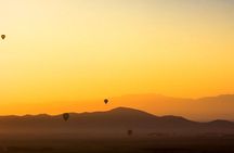 Hot air balloon flight in the desert with camel ride