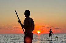 Sunrise Stand Up Paddle activity on a privileged beach.