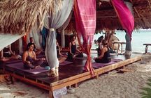 Sunrise yoga class overlooking the beach, the sea & sunrise .