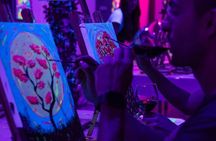 Paint a neon fluorescent picture while drinking unlimited wine