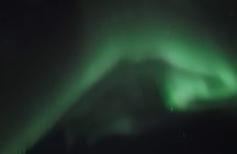 Northern Lights with hot chocolate, donuts and icelandic beer