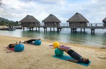 Yoga on the paradise beach of Manava Moorea