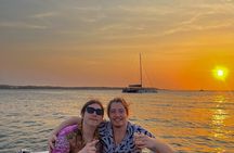 Open bar sunset party in the bay sharing with natives