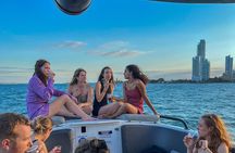 Open bar sunset party in the bay sharing with natives