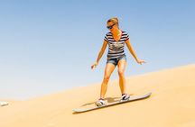 Desert Safari with BBQ Dinner, Camel Ride, Sand Board & Live Show