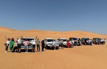 Abu Dhabi: 7-Hours Desert Safari with BBQ, Camel Ride & Sandboarding