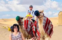 Abu Dhabi: 7-Hours Desert Safari with BBQ, Camel Ride & Sandboarding