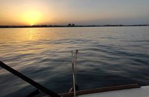 Sailing with sunset and swimming in the sea